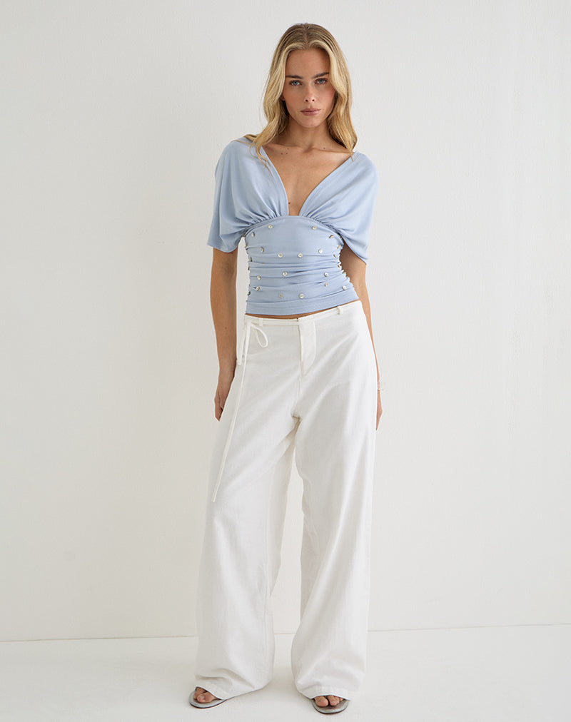 Image of Vernia Plunge Batwing Top in Lyocell Dusty Blue with Pearl Buttons